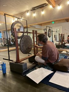 Image of man touching steel percussion